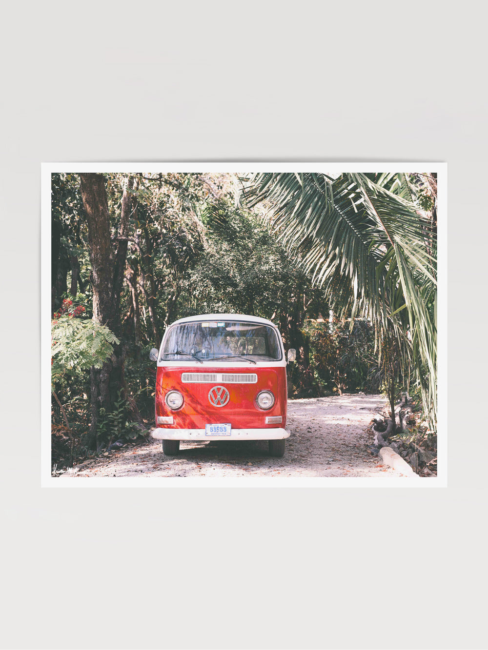 Red VW bus in Costa Rica with palm trees. Photographed by Kristen M. Brown for The Sunset Shop.