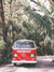 Red VW bus in Costa Rica with palm trees. Photographed by Kristen M. Brown for The Sunset Shop.