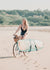 Photographer Kristen M. Brown and Gidget riding a bike on the beach in Tamarindo Costa Rica.