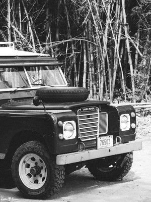 Tucked away in between volcanoes, there lies a magical cloud forest called Monteverde in Costa Rica with a vintage Land Rover series 3 awaiting your arrival. Welcome back to your adventure daydream, all from the comfort of your home...wherever home may be with "Landy Three". Black and white photo print of Land Rover Series 3 by Kristen M. Brown of Samba to the Sea for The Sunset Shop.