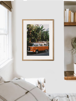 VW Bus photography print hanging in bedroom. Orange VW Bus photo print in Southern California. “Leucadia Bus” photo print of a beautiful vintage VW Bus in Encinitas, California by Kristen M. Brown of Samba to the Sea for The Sunset Shop. 