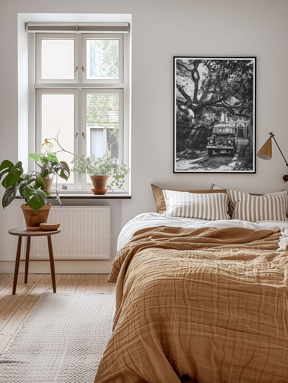 Land Rover black and white photography print hanging above a bed, Hop on into "Longitude Rover" and take a journey down the timeless, charming streets of Charleston in this classic Land Rover Series III. Photo print by Kristen M. Brown of Samba to the Sea for The Sunset Shop.