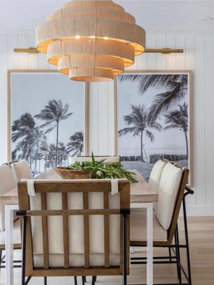 Modern coastal dining room with black and white palm tree photography prints. Fine Art Photos by Kristen M. Brown of Samba to the Sea for The Sunset Shop.