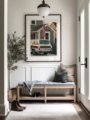 Classic Jeep Wagoneer fine art photo print hanging in entryway. “Main Squeeze Wagoneer“ fine art photo print of classic Jeep Wagoneer parked at a beach house in Cape Cod. Photographed by Kristen M. Brown of Samba to the Sea for The Sunset Shop.