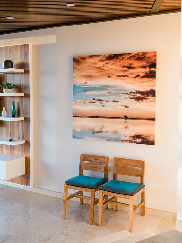 Sunset surf beach photo print hanging in a beach modern home in Tamarindo Costa Rica.. Surfer walking on the beach during a beautiful sunset in Costa Rica. Sunset surfer print by Samba to the Sea at The Sunset Shop.