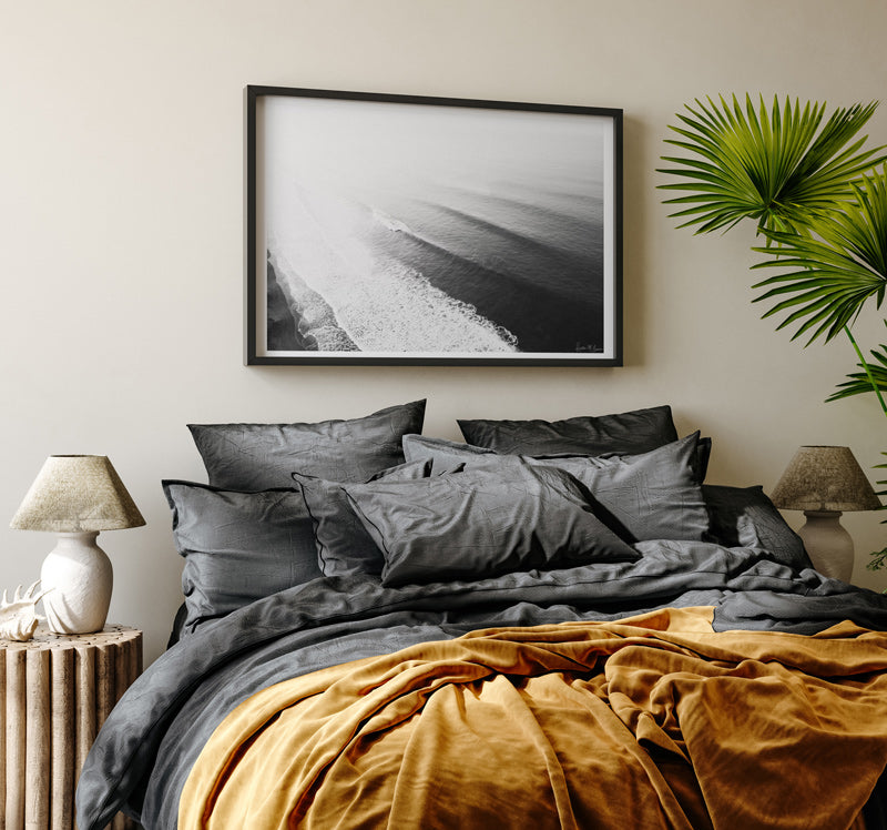 Moody Spanish coastal bedroom with black and white aerial wave photography prints. Fine Art Photos by Kristen M. Brown of Samba to the Sea for The Sunset Shop.