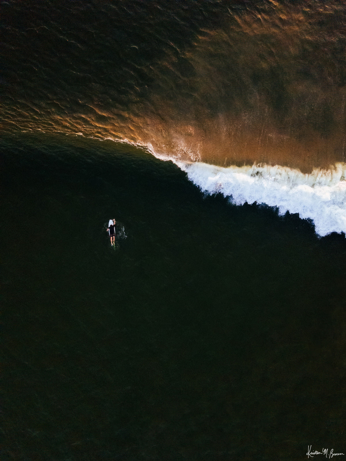 Aerial surfer print by Samba to the Sea at The Sunset Shop. Image is an aerial photo of surfer paddling out to surf in Tamarindo, Costa Rica.