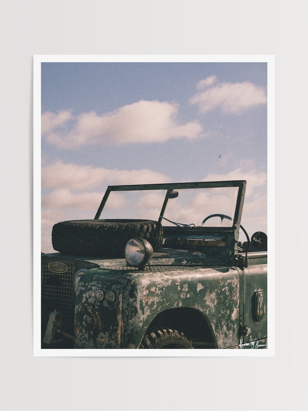 The raw, authentic character of this vintage 1963 Land Rover Series truck, with its iconic hood-mounted spare tire, open-top frame, and soft patina earned through years of adventure, "Patina" embodies the spirit of adventure.  Bring a touch of rugged soul, vintage heritage, and timeless  wanderlust into your space with "Patina", a print that turns rustic wear into pure artistry. Vintage Land Rover photo print by Kristen M. Brown of Samba to the Sea for The Sunset Shop.