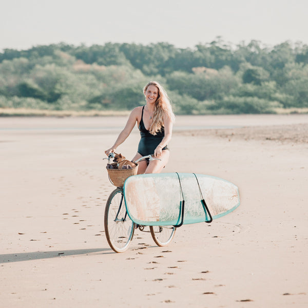 Photographer Kristen M. Brown riding her bike on the beach in Tamarindo, Costa Rica.