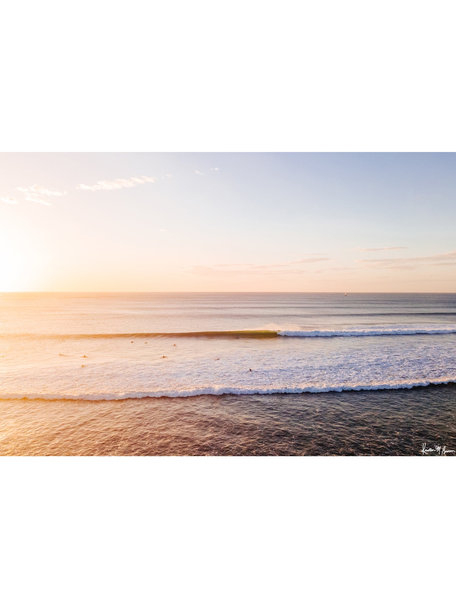 "Playground" aerial wave print by Samba to the Sea at The Sunset Shop. Image is an aerial photo of a wave breaking during sunset in Tamarindo, Costa Rica.
