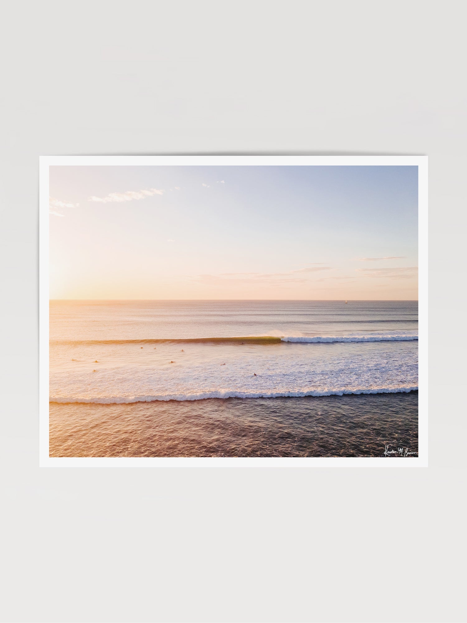 "Playground" aerial wave print by Samba to the Sea at The Sunset Shop. Image is an aerial photo of a wave breaking during sunset in Tamarindo, Costa Rica.