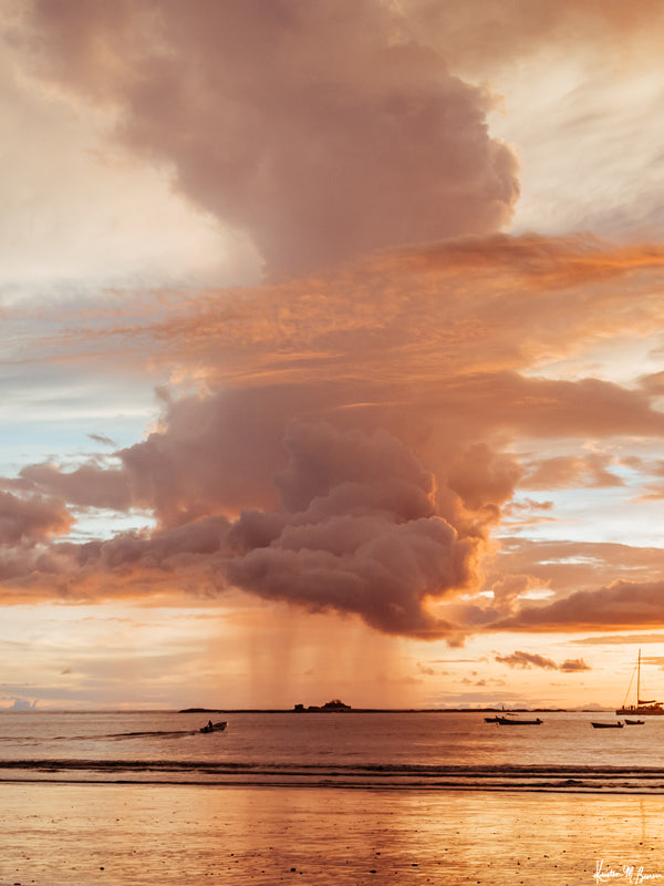 Rose Gold Rain sunset print by Samba to the Sea at The Sunset Shop. Image is a rain shower passing over the horizon during a rose gold sunset in Tamarindo, Costa Rica.