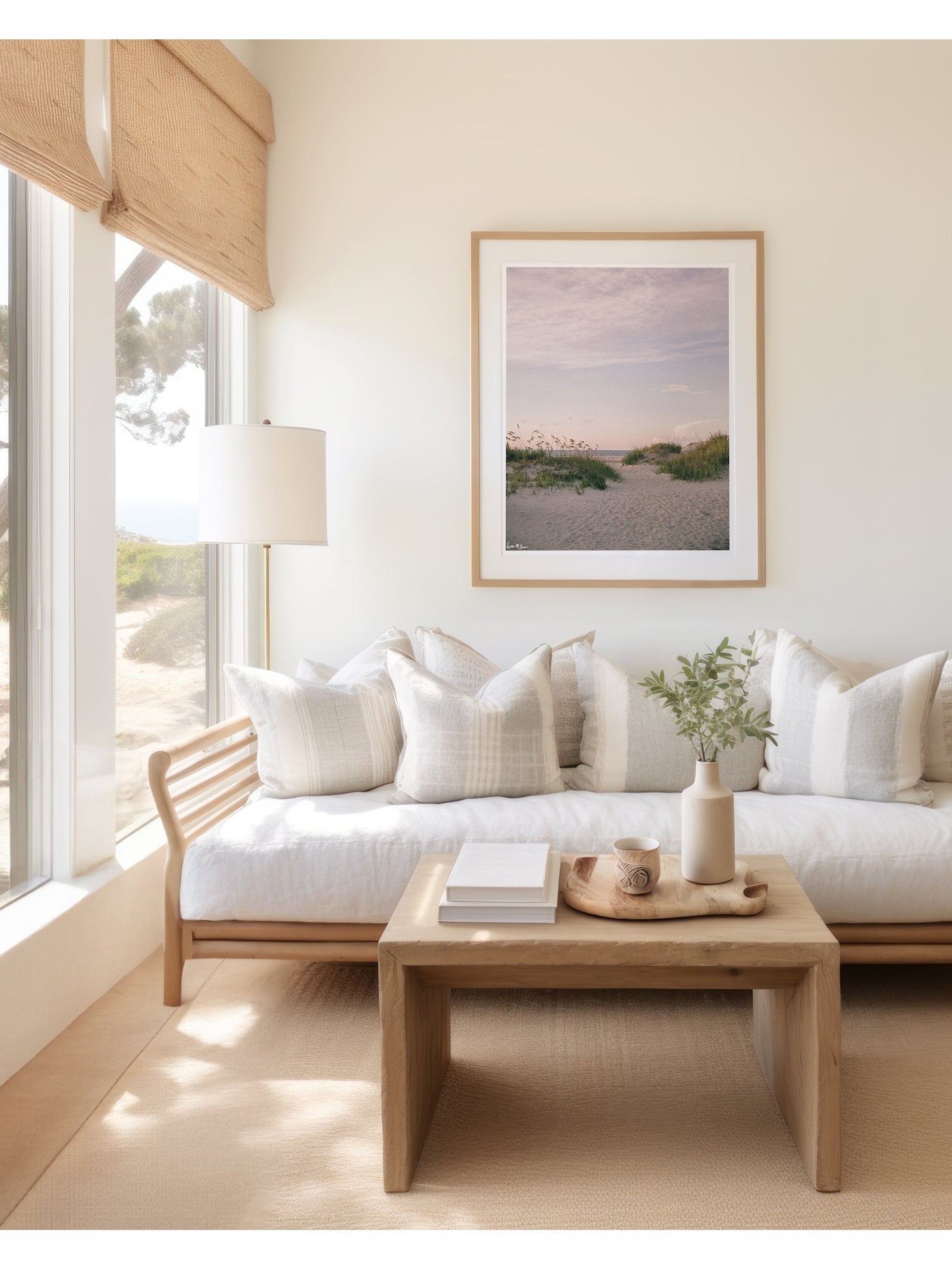 A framed landscape sunrise art print of sunrise in Sullivan's Island, SC. As the morning sun gently ushers in a new day, the coast unfolds in a quiet symphony of soft hues, rustling sea grasses, and an endless horizon. The golden sea oats dance softly in the ocean breeze, inviting you through the beach dunes towards the shoreline. Bring the tranquil rhythm of the ocean and the soothing warmth of a coastal morning into your everyday space with "Sea Oats and Sunrise" photography print.