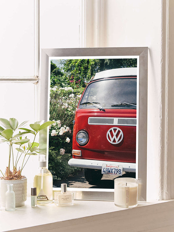 VW Bus photography print in bathroom. Red VW Bus photo print in Southern California. “Sea Rose Bus” photo print of a beautiful vintage VW Bus parked next to white wea roses in California by Kristen M. Brown of Samba to the Sea for The Sunset Shop. 