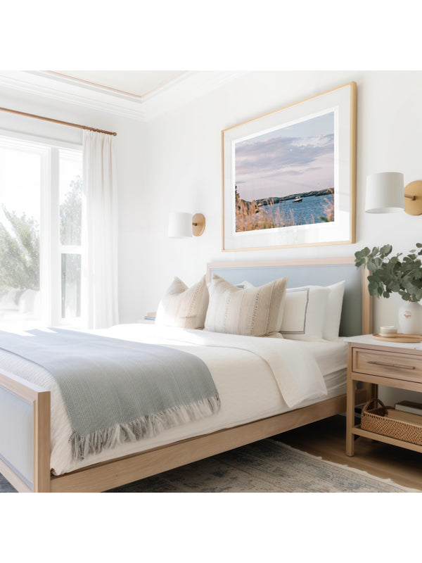 "Seaclusion" photo print of wood motorboat moored along Ocean Drive in Newport, RI framed print hanging in serene coastal bedroom. Photographed by Kristen M. Brown of Samba to the Sea for The Sunset Shop.