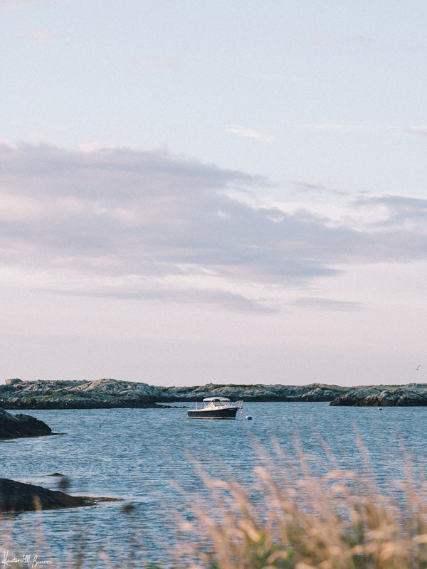 "Seaclusion" photo print of wood motorboat moored along Ocean Drive in Newport, RI. Photographed by Kristen M. Brown of Samba to the Sea for The Sunset Shop.