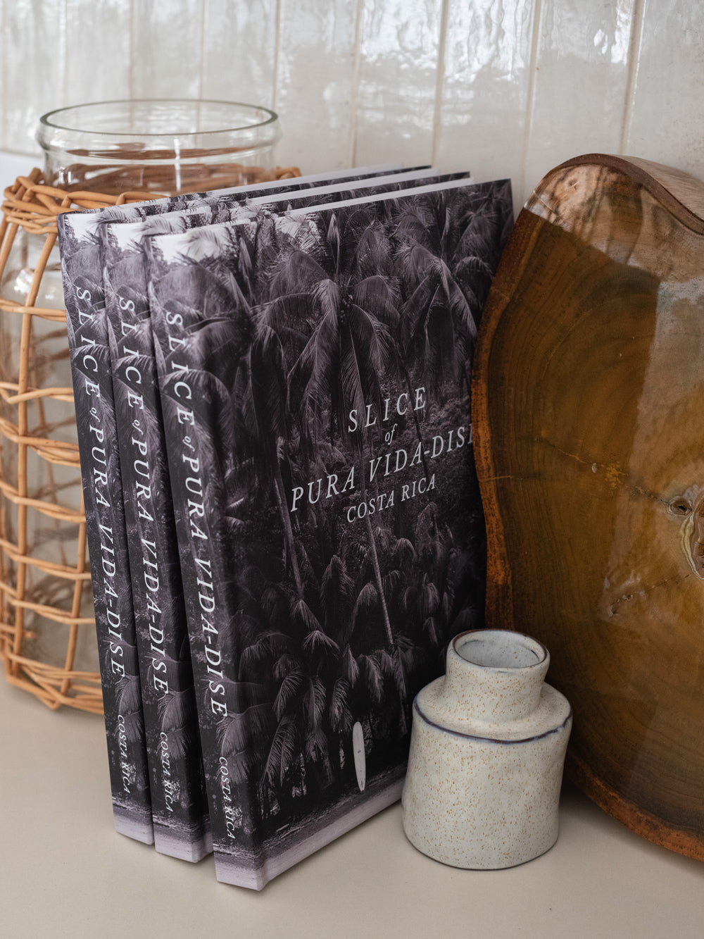 Costa Rica coffee table book. Dream away in this breathtaking photographic journey through Costa Rica's captivating coastline with this fine art Costa Rica coffee table book, Slice of Pura Vida-dise. Experience a part of the laid back “pura vida” way of life Costa Rica is infamous for with over 150 awe-inspiring images of pristine beaches, jaw dropping sunsets, and the alluring surf lifestyle. Photographed by Kristen M. Brown of Samba to the Sea.