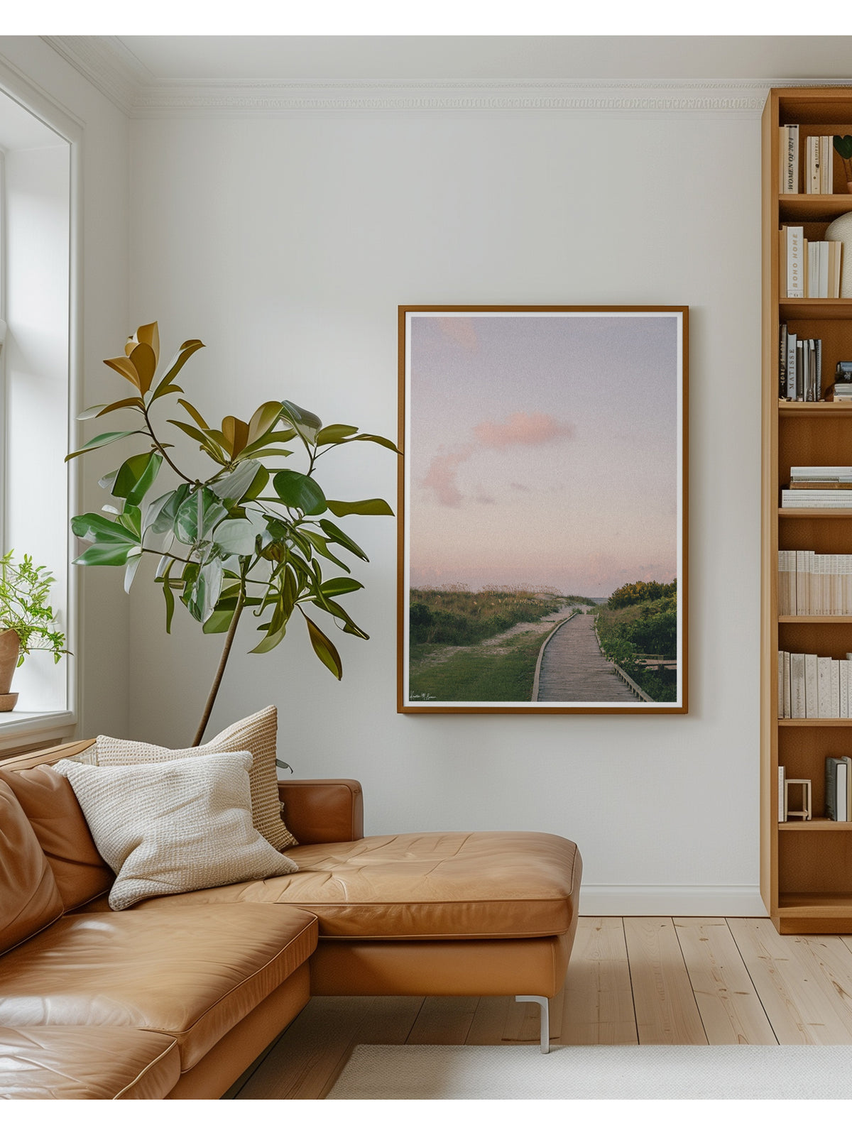 A framed landscape art print of beach path at sunrise in Charleston, SC. Before the world wakes up and when the shoreline belongs entirely to you, a pastel cloud drifts through a sky painted in soft blushes of pink, peach, and muted lavender, catching the very first light of dawn through the beach dunes and path boardwalk Station on Sullivan’s Island, SC. Bring home that feeling with "Station Sunrise". Photo print by Kristen M. Brown of Samba to the Sea for The Sunset Shop.