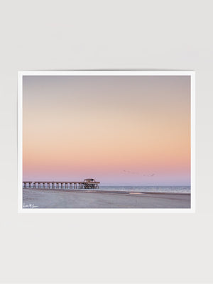 Beautiful pastel pink sunset of Tybee Island Pier in Tybee Island, Georgia. Photographed by Samba to the Sea for The Sunset Shop.