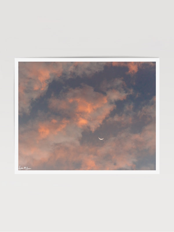 Crescent moon against a cotton candy pink sunrise sky in Savannah Georgia. To the Moon and Back II crescent moon print by Samba to the Sea at The Sunset Shop.