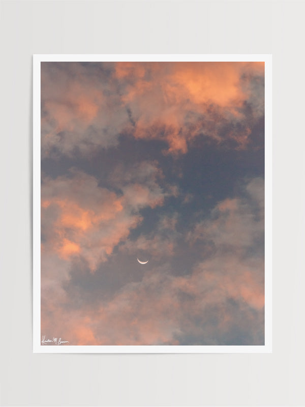 Crescent moon against a cotton candy pink sunrise sky in Savannah Georgia. To the Moon and Back II crescent moon print by Samba to the Sea at The Sunset Shop.