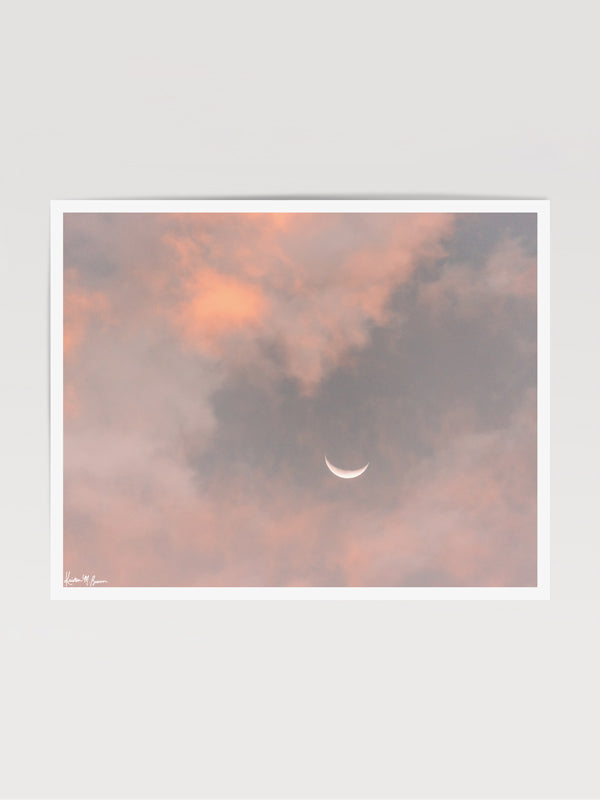 Crescent moon against a cotton candy pink sunrise sky in Savannah Georgia. To the Moon and Back crescent moon print by Samba to the Sea at The Sunset Shop.