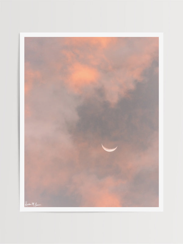 Crescent moon against a cotton candy pink sunrise sky in Savannah Georgia. To the Moon and Back crescent moon print by Samba to the Sea at The Sunset Shop.