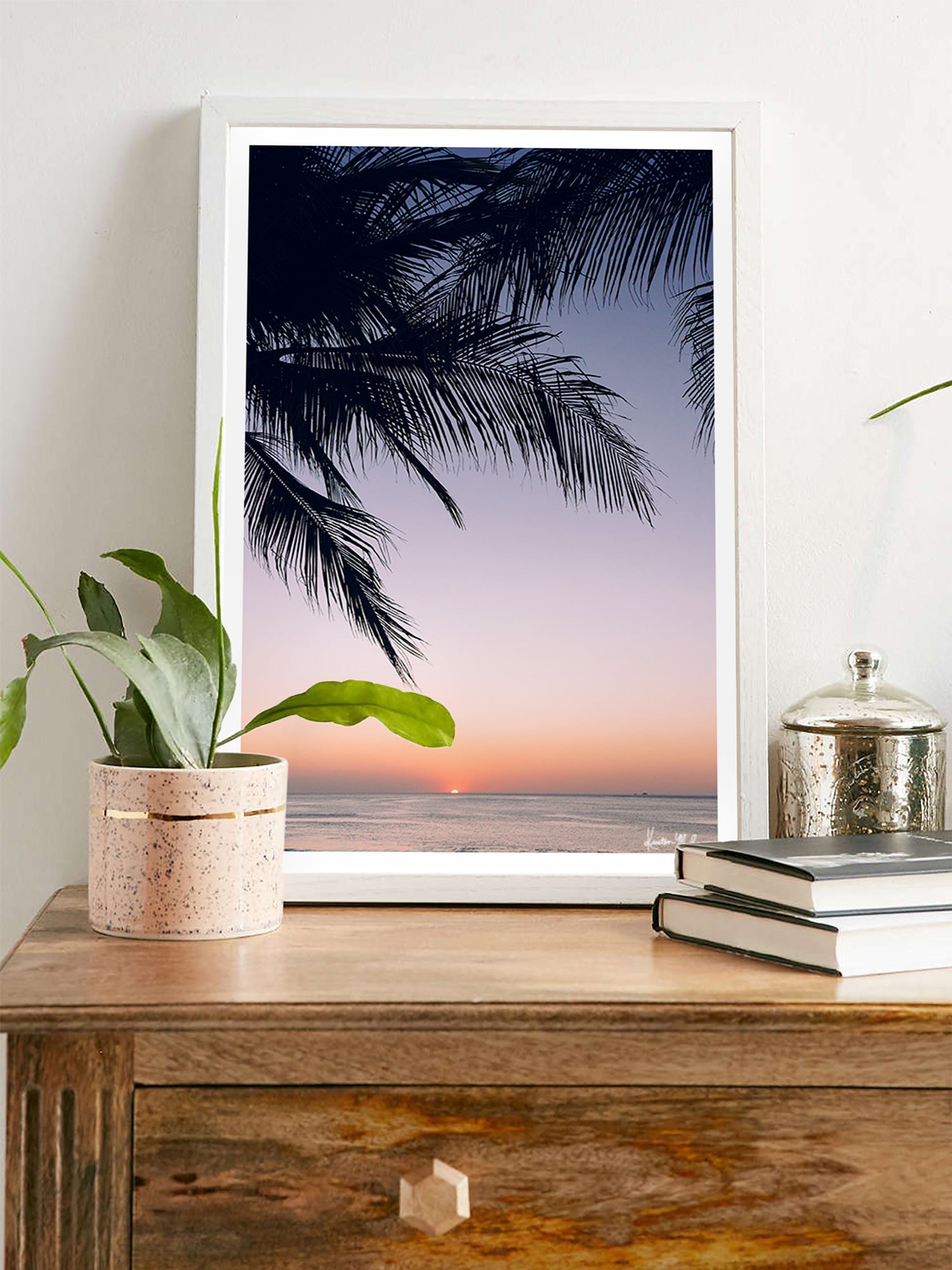 Living room wall art of beautiful palm tree silhouette with an ombre sunset sky over the ocean in Costa Rica. Photographed by Samba to the Sea for The Sunset Shop.