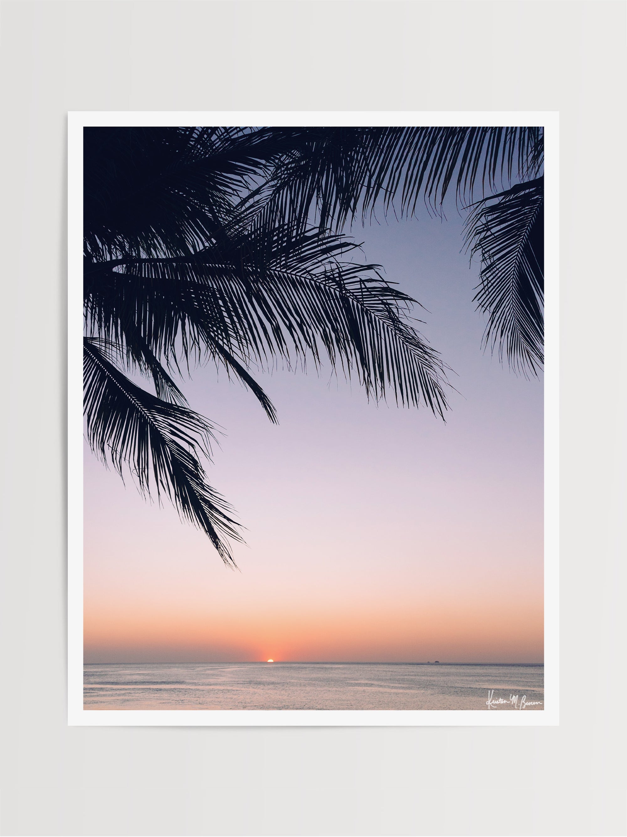 Beautiful palm tree silhouette with an ombre sunset sky over the ocean in Costa Rica. Photographed by Samba to the Sea for The Sunset Shop.