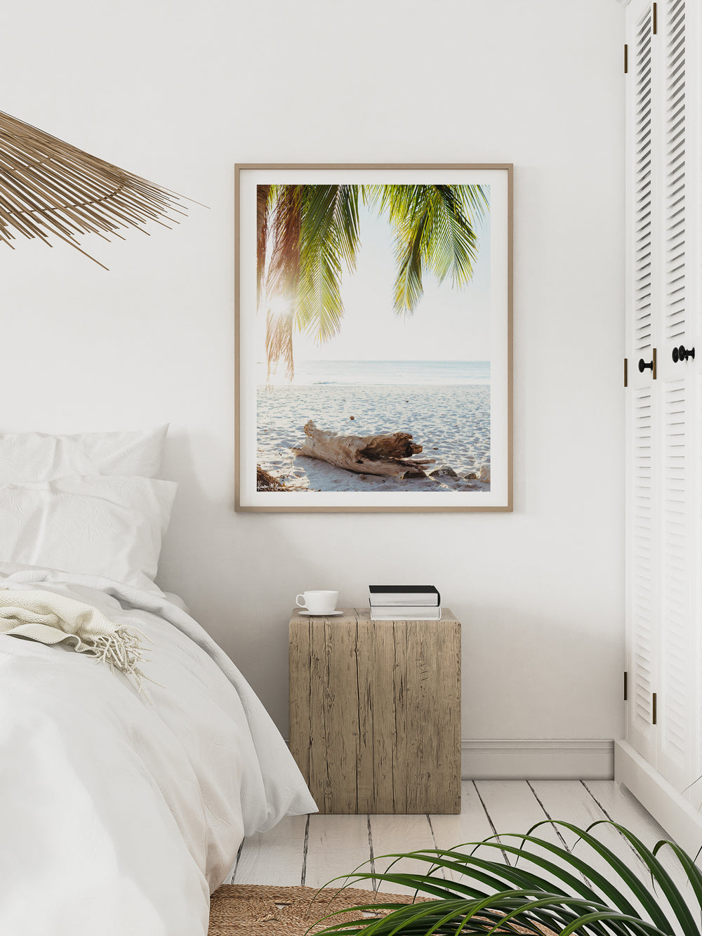 White boho coastal bedroom with tropical palm tree photo print. Surf shack and beach bungalow vibes. "Via Paradise" beach print by Kristen M. Brown of Samba to the Sea for The Sunset Shop.