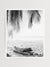 You can’t help but smell the ocean air and feel the warmth of the sun on your skin with one glance at this gorgeous driftwood log under a swaying palm trees at the beach in Costa Rica. Welcome back to your tropical paradise. "Via Paradise" black and white beach palm tree print by Samba to the Sea.