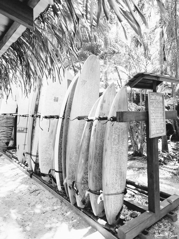 Eeny, meeny, miny, moe...pick your favorite wave sleigh and let's paddle out! Or better yet, pick one a day and try them all out! "Wave Sleighs" black and white black and white photo print of a quiver of surfboards in Nosara, Costa Rica.