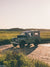 There's nothing like knowing that a day of adventure with your Rover is on tap to get you out of bed in the morning! Especially when that adventure has you exploring Cape Cod's beautiful beaches on a pristine blue sky day. So what are you waiting for? Hop on into this Series III that's glowing in the early morning light and get going! Photo print by Kristen M. Brown of Samba to the Sea for The Sunset Shop.