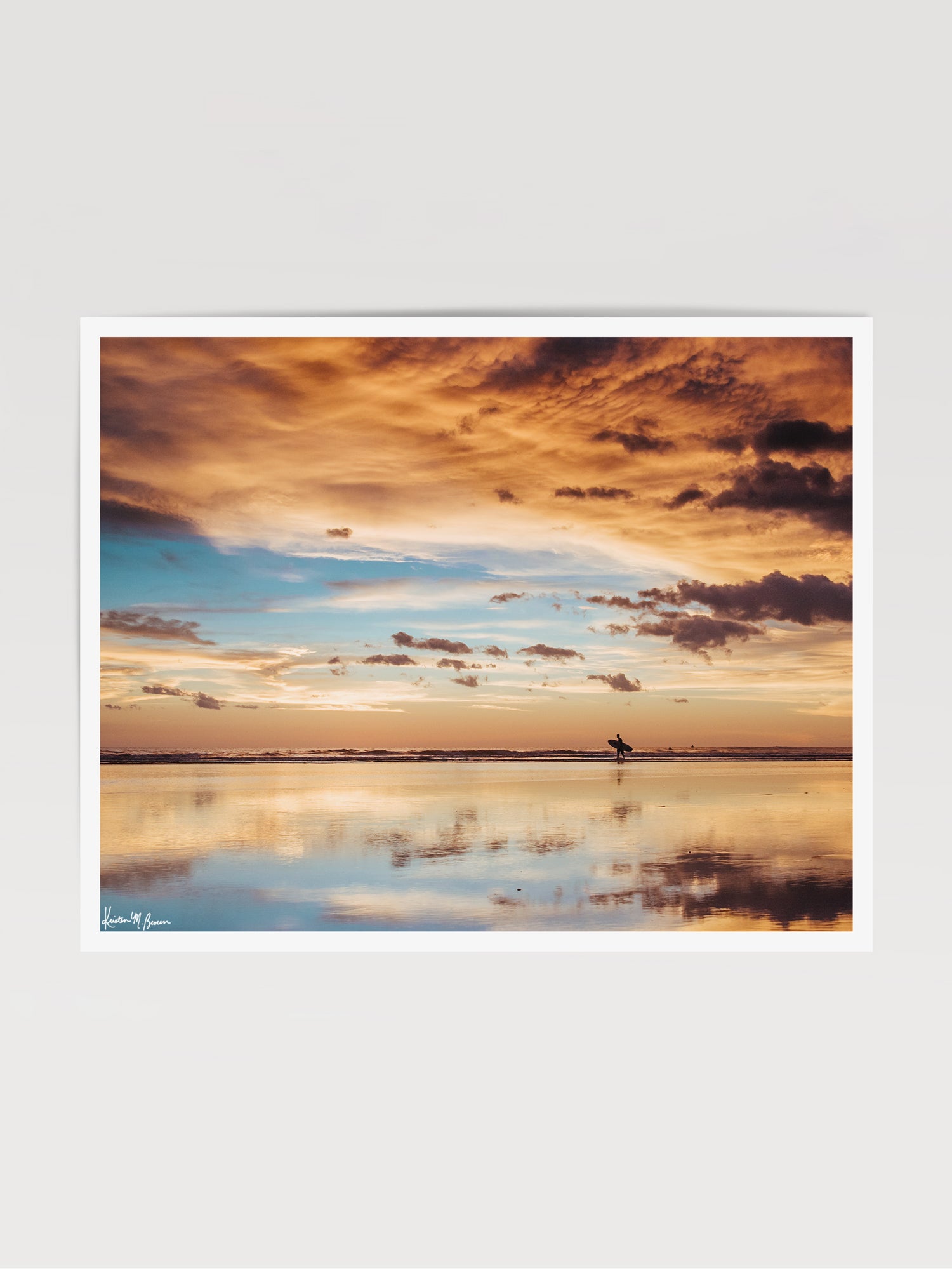 Fine art photography print of a surfer walking on the beach during a beautiful sunset in Costa Rica. Sunset surfer print by Samba to the Sea at The Sunset Shop.