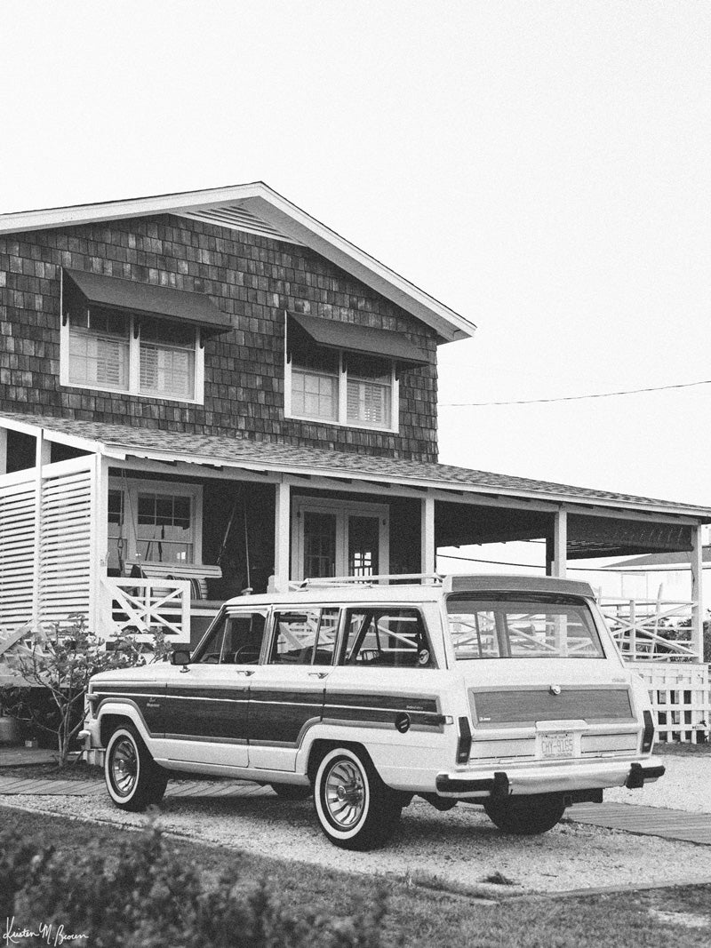 The Jeep that started an entire culture of Jeep lovers -- the Wagoneer! Welcome back to that amazing family beach vacation, all from the comfort of your smart home...wherever that smart home may be with this B&amp;W photo print &quot;Wrightsville Wagoneer&quot;.  Photographed by Kristen M. Brown of Samba to the Sea for The Sunset Shop.