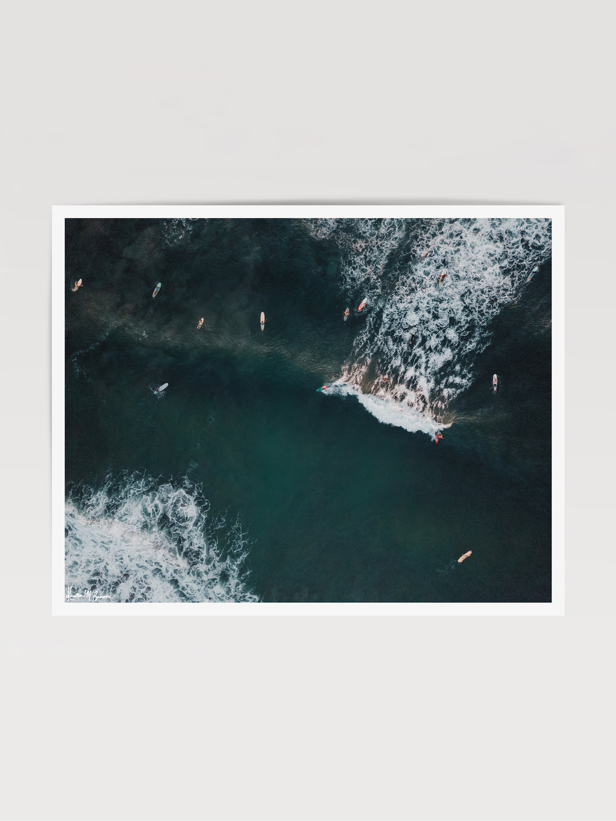 You Go Left and I&#39;ll Go Right aerial surfer print by Samba to the Sea at The Sunset Shop. Image is an aerial photo of surfer&#39;s splitting the peak in Tamarindo, Costa Rica.