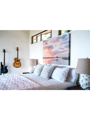 "Angel del Mar" sunset surfer girl wall art. Canvas photo print of surfer girl walk on the beach with her surfboard during a gorgeous sunset in Tamarindo, Costa Rica. Surfer girl canvas hung in beautiful ocean view home "Angel Mar" in Tamarindo. Photographed by Kristen M. Brown, Samba to the Sea.