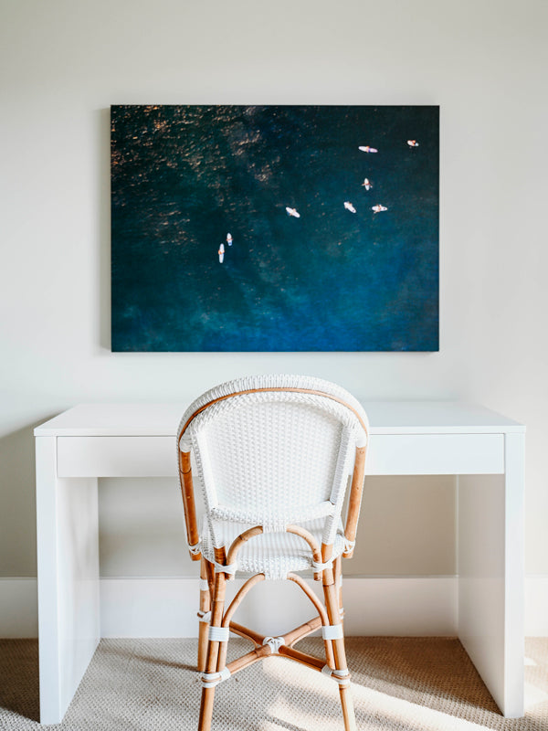 "Board Meeting" aerial image of surfers in ocean in Costa Rica hanging above desk. Photograph by Kristen M. Brown of Samba to the Sea at The Sunset Shop.