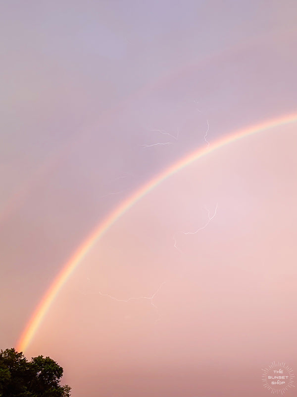 Be here now, right in this magical moment. Because life is too beautiful to not take a moment to revel in the magical beauty that surrounds us, like this vibrant rainbow painting the sunset sky as lightning cracks. Photo by Kristen M. Brown of Samba to the Sea.