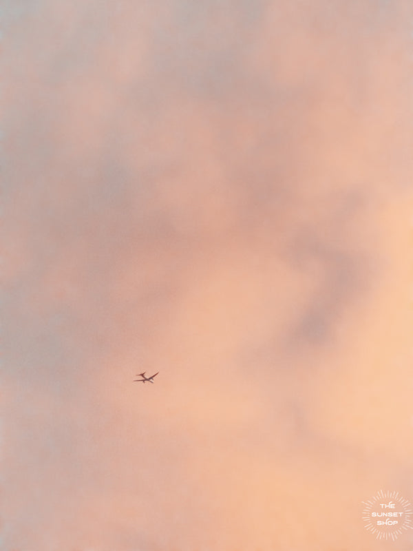 Just look up and you may find a plane gliding through the dreamy cotton candy sunset sky in Miami! &quot;Fly Away With Me&quot; photographed by Kristen M. Brown, Samba to the Sea.