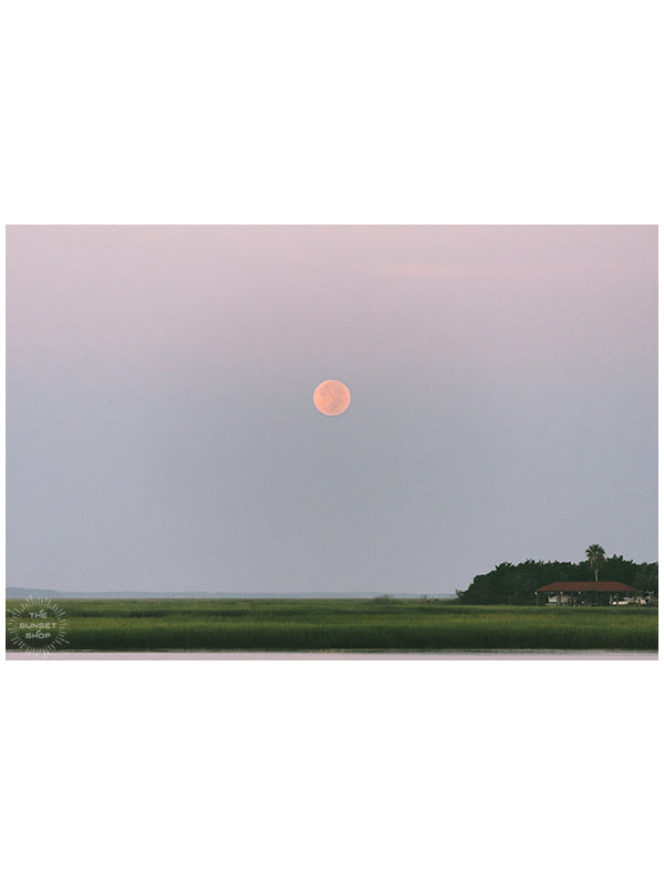 Good night moon! 😍🌝🌅 It definitely is worth waking up before sunrise when you get to see this beautiful sight, the full moon glowing pink as it sets over the marsh in Savannah, GA. "Full Moon Marsh" photo by Kristen M. Brown of Samba to the Sea for The Sunset Shop.
