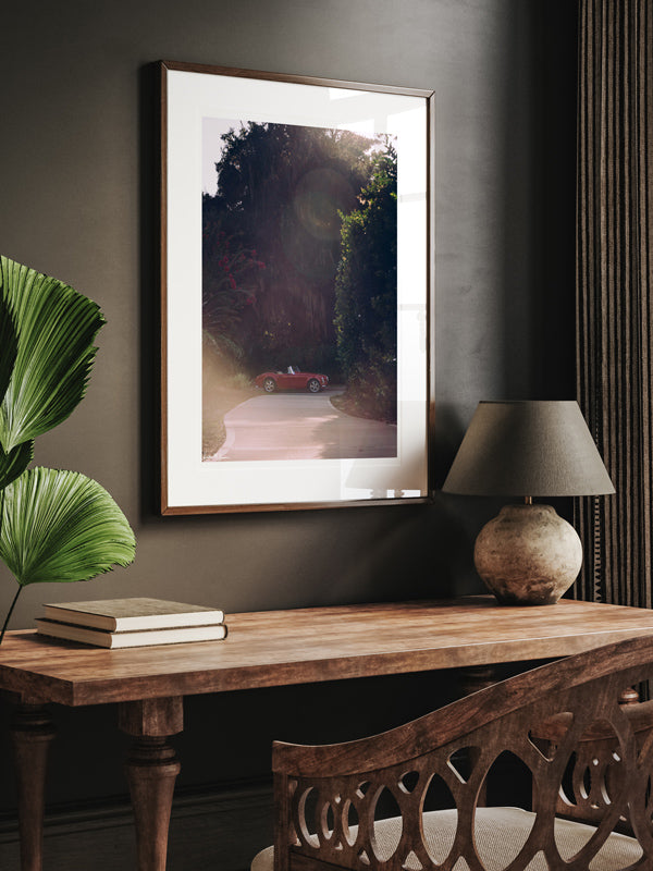 You that top down, wind in your hair, late afternoon sun kissing your face feeling? Yeah, that feeling of carefree days -- it's a feeling like no other. Especially when you're rolling in a gorgeous Austin Healey in a vibrant shade of red that purrs like no other. "Furia Roja - Red Fury" classic sports car photo print by Kristen M. Brown of Samba to the Sea for The Sunset Shop.