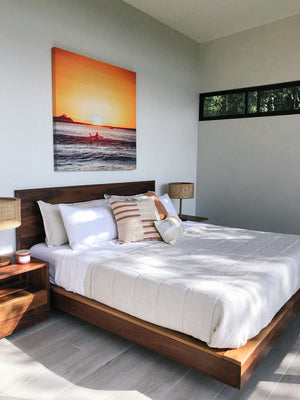 "The Girl + The Water" sunset surfer print hanging in ocean view bedroom in Dominical, Costa Rica. By Samba to the Sea at The Sunset Shop.