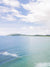 Aerial image of the the beach in Tamarindo Costa Rica. Drone image of turquoise ocean water and surfers. Aerial beach print by Samba to the Sea at The Sunset Shop.