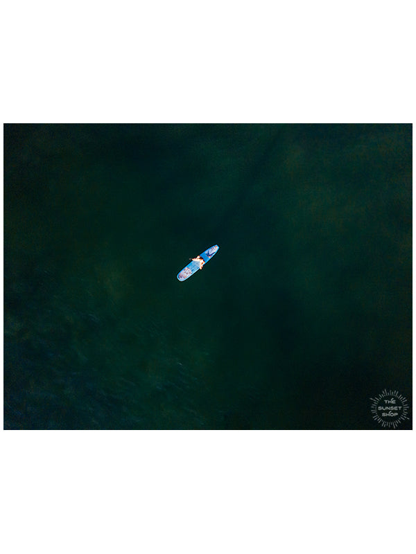 Close your eyes and transport yourself back to your happy place, sitting on your surfboard in the warm ocean, waiting for the the next wave to roll through. Aerial surfer girl photo in Costa Rica by Samba to the Sea at The Sunset Shop.