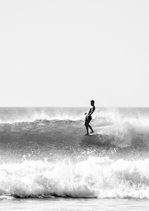 Wingnut from Endless Summer hanging five surfing in Tamarindo Costa Rica.Wingnut from Endless Summer hanging five surfing in Tamarindo Costa Rica. Photographed by Kristen M. Brown Samba to the Sea at The Sunset Shop.