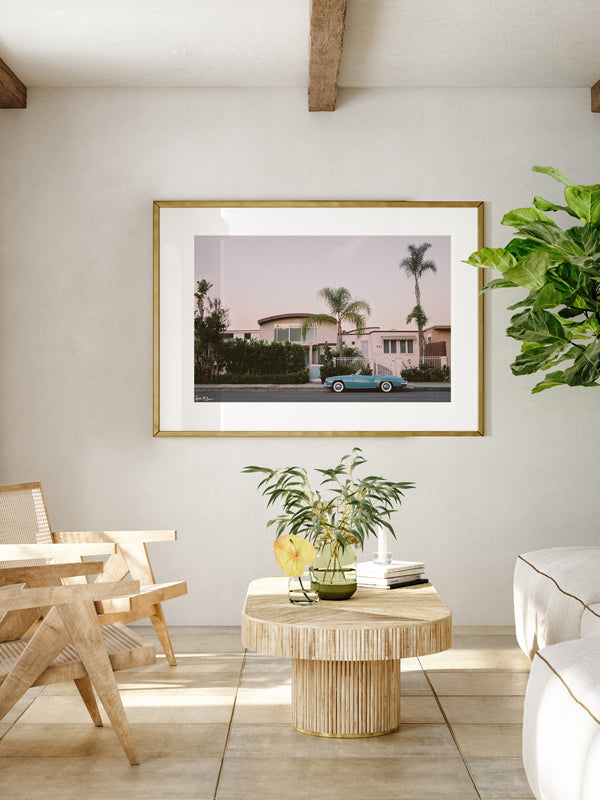 Vintage Mercedes Benz convertible photography print hanging in living room. "Laguna Beach Blue Benz" Mercedes Benz 300SL photo print by Kristen M. Brown of Samba to the Sea for The Sunset Shop.