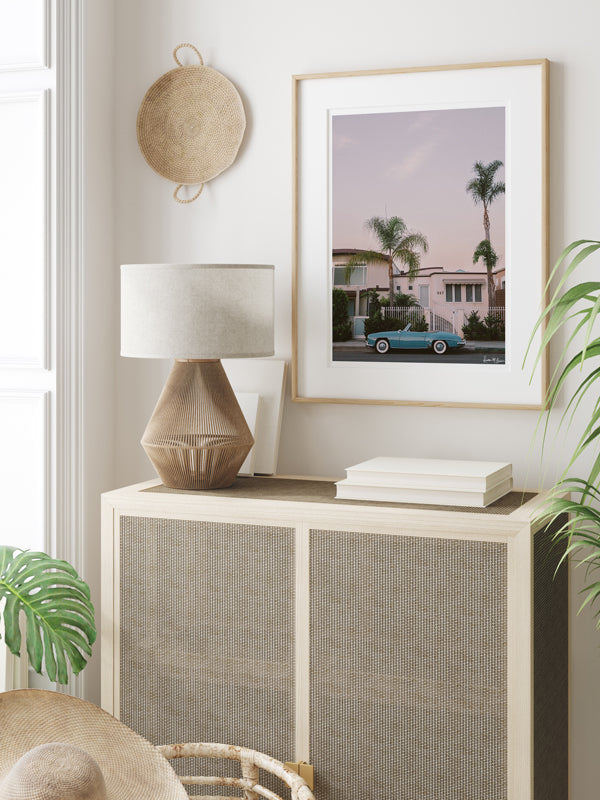 Vintage Mercedes Benz convertible photography print hanging in tropical living room. "Laguna Beach Blue Benz" Mercedes Benz 300SL photo print by Kristen M. Brown of Samba to the Sea for The Sunset Shop.