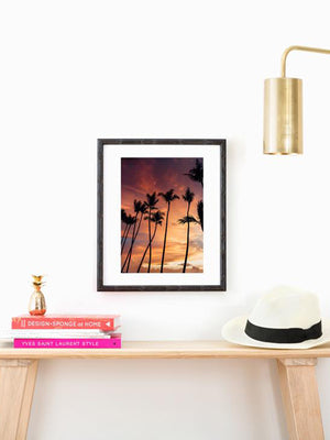 Palm tree sunset fine art print. Beautiful palm tree silhouette pink sunset in Costa Rica. Photographed by Samba to the Sea for The Sunset Shop, framed by Framebridge.