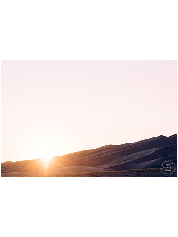 Whatever path you are on at this moment in life, whether it be paved, bumpy, the yellow brick road, or 1,000 feet straight up on loose sand at The Great Sand Dunes, always remember that the beauty in life also happens during the journey. Live it with soul, passion, love, and joy, always + always!  Pastel Sunset over The Great Sand Dunes in Colorado. &quot;Meraki&quot; photographed by Kristen M. Brown of Samba to the Sea for The Sunset Shop.